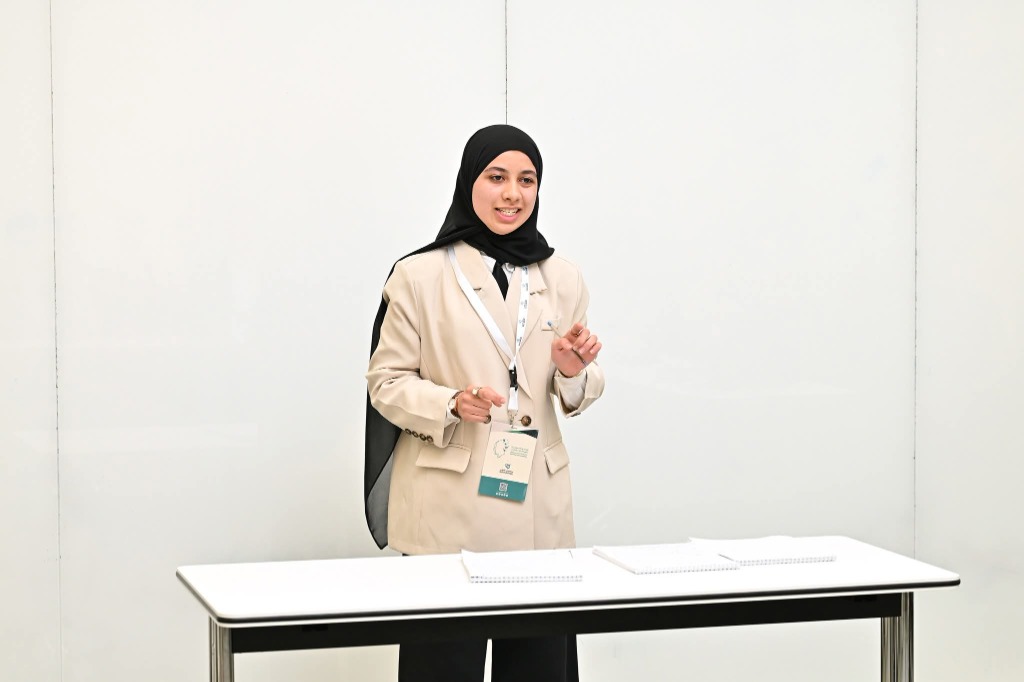Youth delegate delivering keynote debate speech